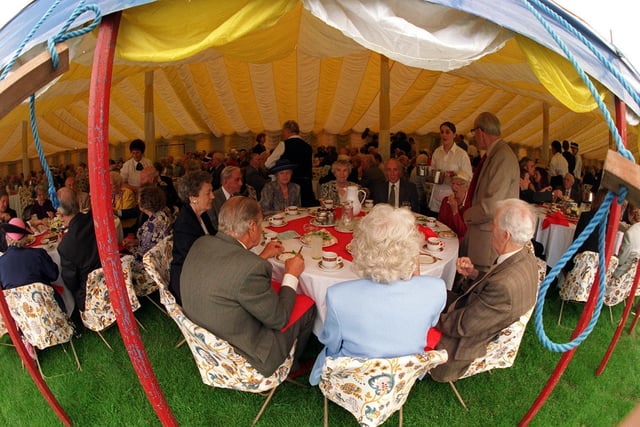Harewood House hosted a Royal Garden Party in July 1997. Pictured are guests enjoying afternoon tea under cover.