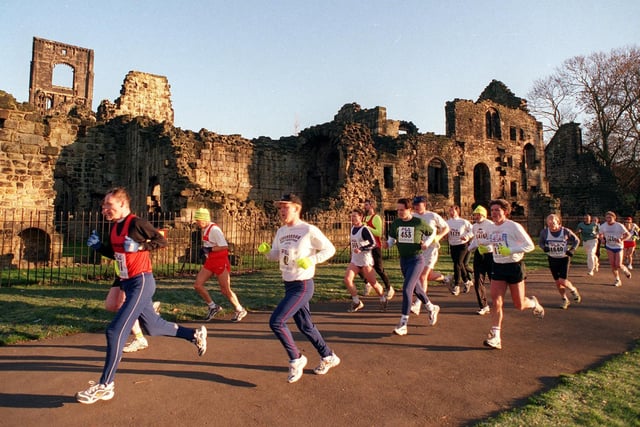 Abbey Dash runners make their way past Kirkstall Abbey in December 1998.