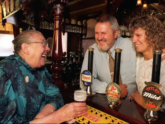 Majorie Farnsworth, left, enjoys a drink in the Cardigan Arms on Kirkstall Road with  publicans Barrie and Janet Edmonds in June 1997. The couple rescued her from her blazing flat nearby and received bravery awards from West Yorkshire Fire Service.