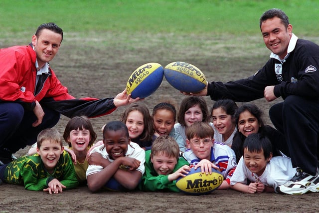 Leeds Rhinos players Francis Cummins (left) and Martin Masella coach children from Kirkstall Valley Primary School at Headingley in May 1998.