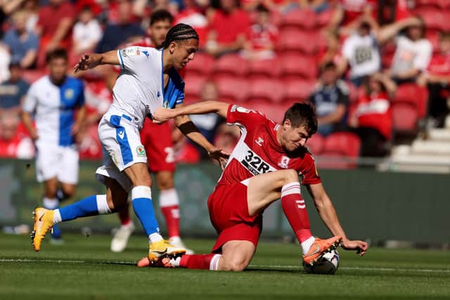 DECISION DUE: On the immediate future of Leeds United's Ian Poveda, left, at Blackburn Rovers, the attacker pictured challenging Paddy McNair in August's Championship clash at Middlesbrough. Picture by Richard Sellers/PA Wire.