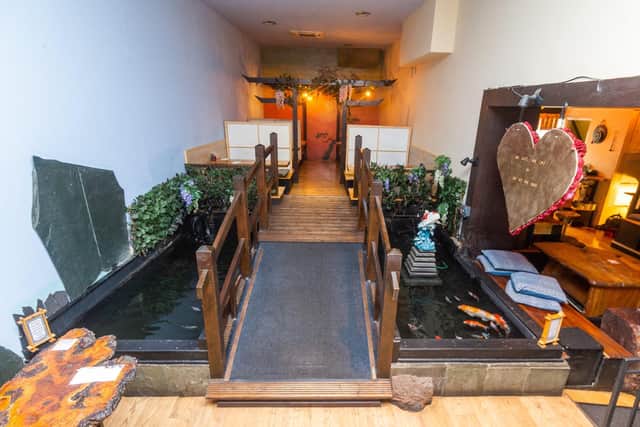 The restaurant has retained its striking original design with a water feature and tables made out of reclaimed wood (Photo: James Hardisty)