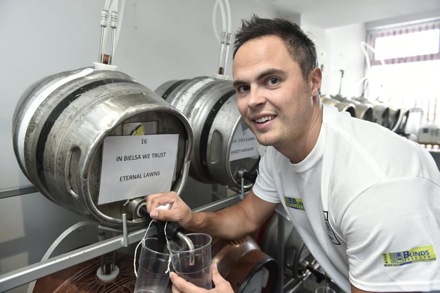 Morley cricketer Matthew Dowse pours a In Bielsa We Trust beer.