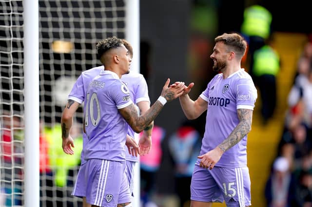 PUT IT THERE! Stuart Dallas, right, celebrates with Raphinha, left, after the Brazilian winger's strike put the Whites 1-0 up against Watford at Vicarage Road in their last game before the current break. Picture by John Walton/PA Wire.