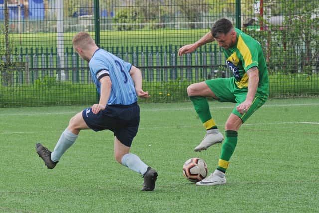 Middleton Reserves' Kirk Thompson shows some nifty footwork to bamboozle Huddersfield Amateurs' Nick Raw. Picture: Steve Riding.
