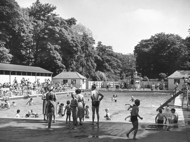 A busy swimming pool in June 1953.