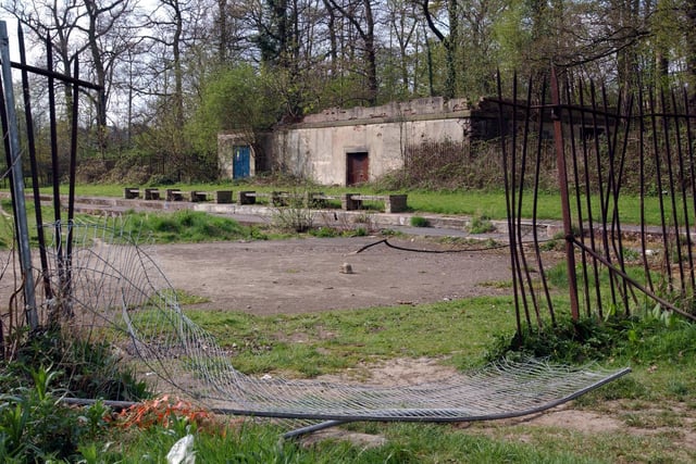 The derelict remains of  the former outdoor swimming pool in April 2003.