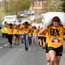 The race, which attracted hundreds of spectators, saw runners start from the Royal Oak pub to the Maypole Green in the village centre.