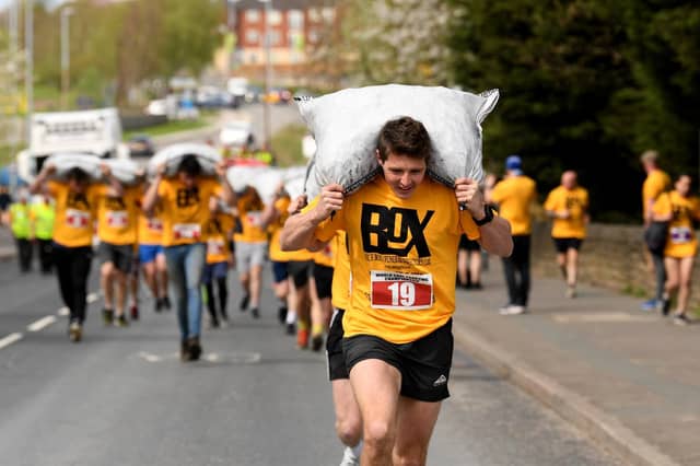 The race, which attracted hundreds of spectators, saw runners start from the Royal Oak pub to the Maypole Green in the village centre.