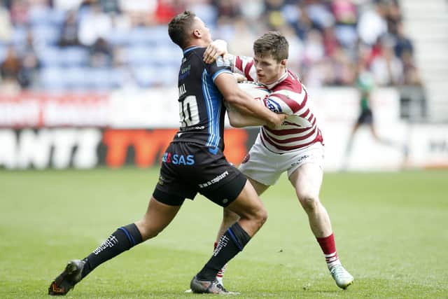 Wakefield Trinity's Corey Hall tries to stop the Wigan Warriors juggernaut in the guise of John Bateman. Picture: Ed Sykes/SWpix.com.