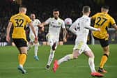 STEPPING FORWARD: Leeds United's Sam Greenwood, centre, who bagged his first Whites assist in just his fifth outing for the first team in last month's Premier League clash at Wolves, above. Picture by Bruce Rollinson.