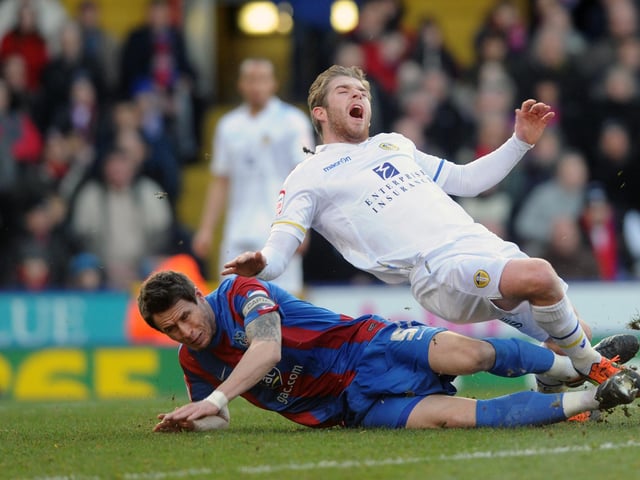 Adam Clayton is brought down by Paddy McCarthy.