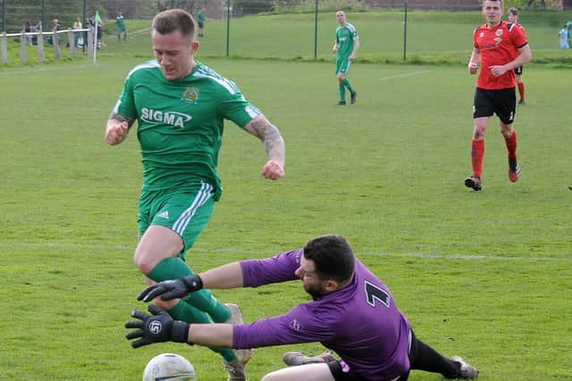 Beeston St Anthony's goalscorer Joe Thornton is thwartedon this occasion by Knaresborough Town goalkeeper Liam Corbett. Picture: Steve Riding.