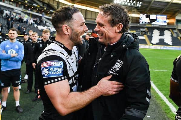 Luke Gale celebrates Hull's win over Warrington with coach Josh Hodgson. Picture by Will Palmer/SWpix.com.
