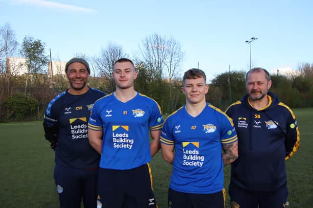 Rhinos under-18s/reserves coach Chev Walker, left, with (left to right) players Jake Higgings and Bailey Aldridge and academy boss Simon Bell. Picture by Leeds Rhinos.