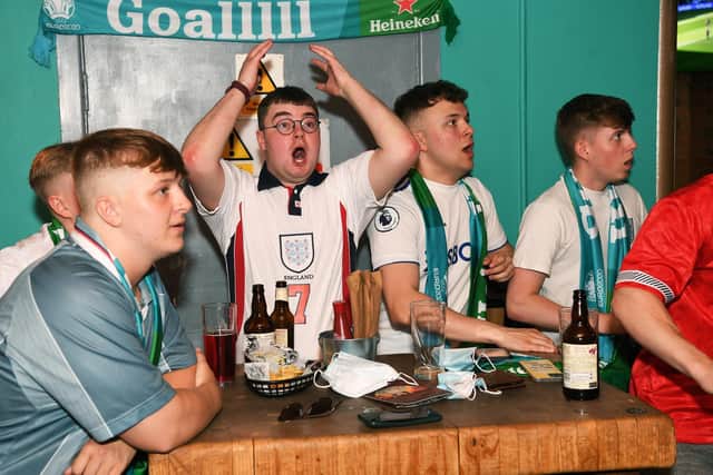 England fans watch the England v Croatia match in the Aire Bar, Leeds. Picture: Jonathan Gawthorpe