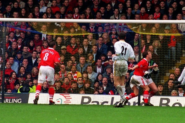 Striker Jimmy Floyd Hasselbaink rises at the far post to head Leeds in front.