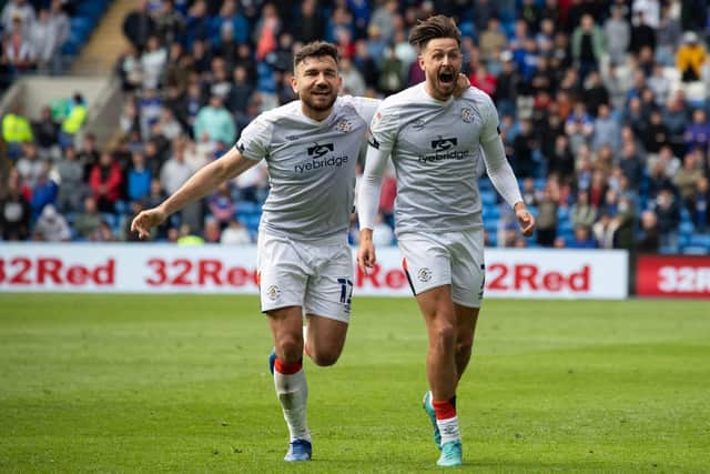 Robert Snodgrass celebrates with Luton Town goalscorer Harry Cornick during the Hatters' 1-0 win over Cardiff City. Pic: Athena Pictures.