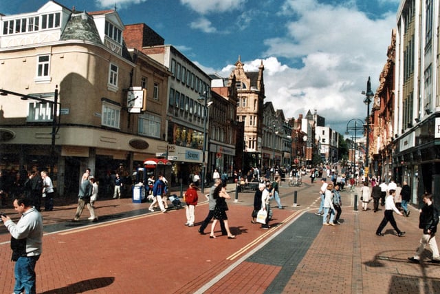 September 1999 and along the left is H Samuel, jewellers, Saxone shoe shop, and Alliance and Leicester building society. On the right is Principles Fashions.
