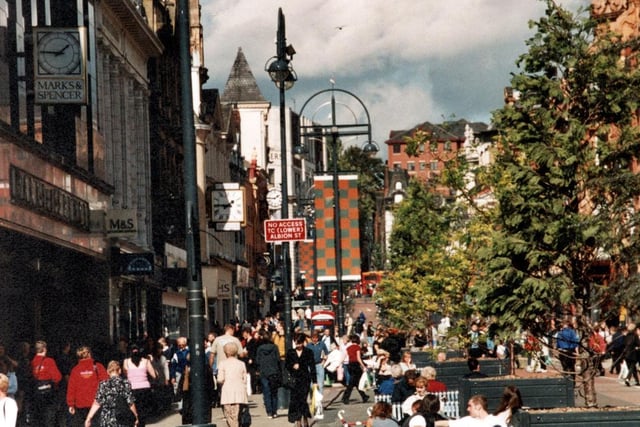 There are three clocks in this photo: above Marks and Spencers, Dixons and the Queen's arcade.