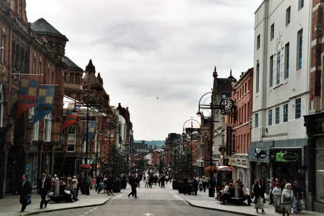Looking down from the top of Briggate. Victoria Quarter, Debenhams and Marks and Spencer are on the left. On the right are more shops including Schuh shoes, USC clothing shop and The Alliance and Leicester Building Society.