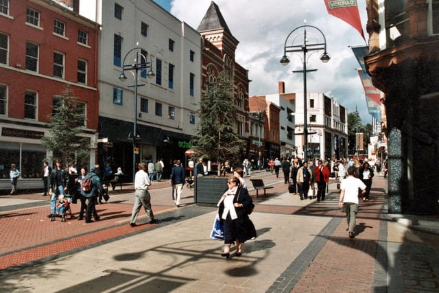 Looking along Briggate towards the Headrow with Allders department store visible in the background.  Country Casuals and Schuh can be seen.