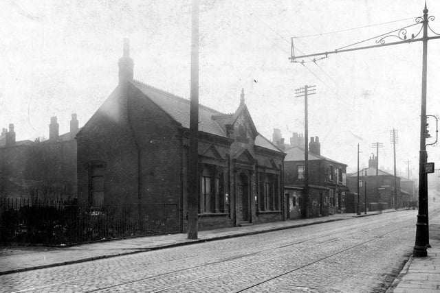 Armley Road looking away from Low Moor Side towards junction with Branch Road pictured in April 1929. The building in the foreground is the Armley District Poor Rate office which also housed the Leeds Overseers Office (Armley District).