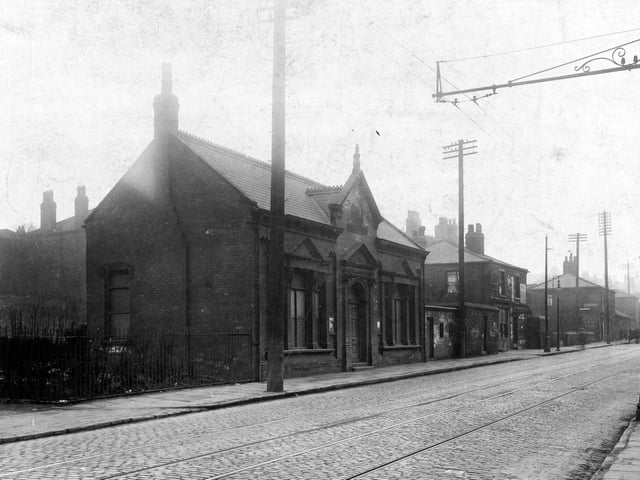 Armley Road looking away from Low Moor Side towards junction with Branch Road pictured in April 1929. The building in the foreground is the Armley District Poor Rate office which also housed the Leeds Overseers Office (Armley District).