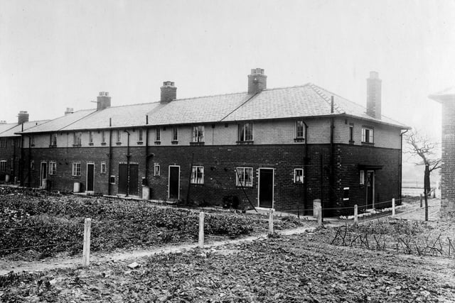 Newly completed homes on the Wyther housing estate in June 1921. A large area in front of the houses has been turned into an area where the residents can plant things.