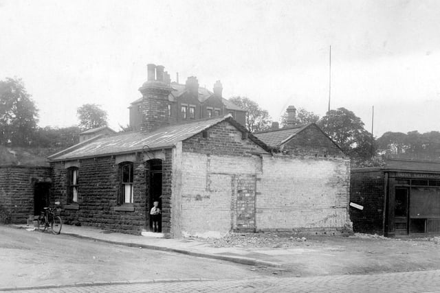 A fish and chip shop on Stanningley Road in a building that was the former 'Old Toll House'. It was later occupied by Goodman's Cafe. The property on the right is Harry Glover, butchers. Visible in the distance are semi-detached houses on Green Hill Road. The photo dates back to June 1929.