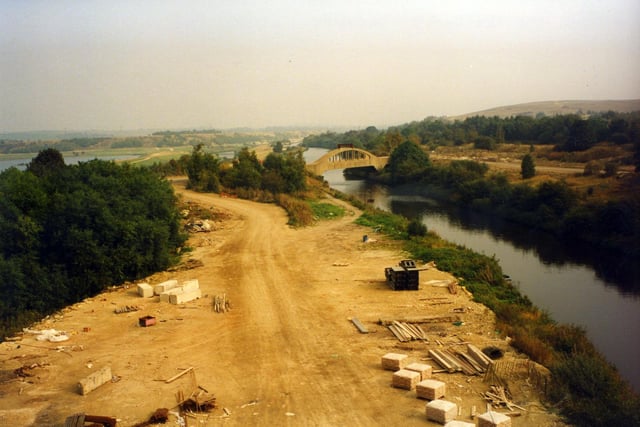 Construction taking place of the M1 motorway extension, seen here alongside the River Aire, which is crossed by the Rothwell Field Bridge in the centre. The extension, from Middleton to Aberford, was opened in February 1991.