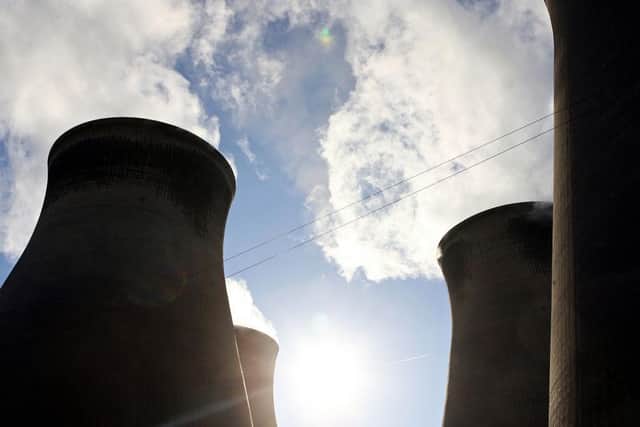 Steam rises from the eight cooling towers at the Ferrybridge power station near Leeds, in the north of England, 30 October 2006.