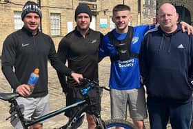 Jake, second right, with friends Zack McComb and Andrew Elliot, along with dad Andrew Hancock, who helped Jake through different parts of the event.