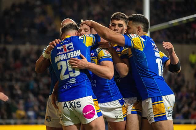 Brad’s brace: Leeds Rhinos’ Brad Dwyer is mobbed by team-mates after scoring one of his two tries in the Betfred Super League win against Toulouse Olympique last night.
Picture Bruce Rollinson