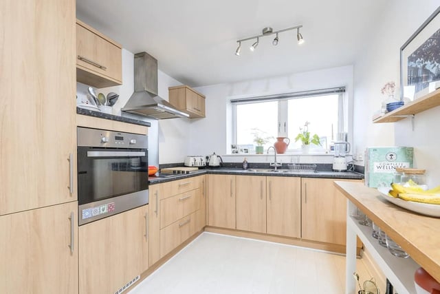 The kitchen is fitted with a built-in oven and fridge freezer.