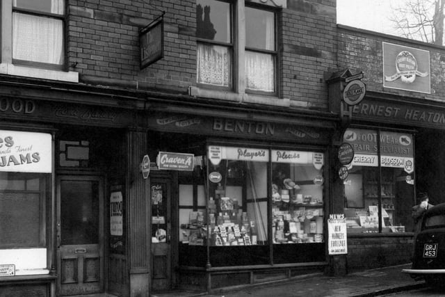 Shops on the north-east side of Burley Road in February 1954. They are E. Heaton, boot repairs, H. Benton, newsagent, and C. Greenwood, baker.