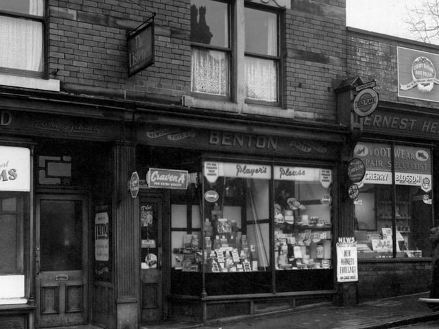 Shops on the north-east side of Burley Road in February 1954. They are E. Heaton, boot repairs, H. Benton, newsagent, and C. Greenwood, baker.
