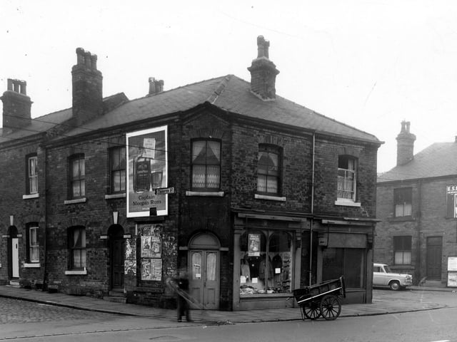 Thornton Street is on the left at the corner with Kirkstall Road pictured in October 1959. To the right is an empty shop. Next is the corner with Metcalf Street, on the right is E. Fishburn newsagent.