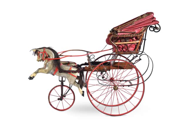 A Victorian, or Edwardian children’s horse and carriage, believed to have been sat in by Queen Victoria as a child.
