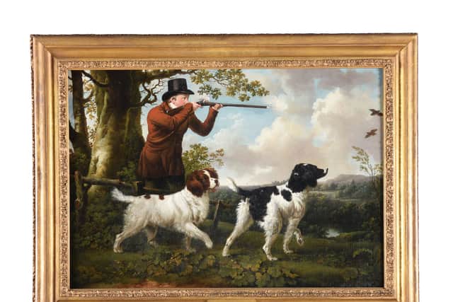 A Huntsman with Two Spaniels is by the English painter Charles Towne (1763–1840)