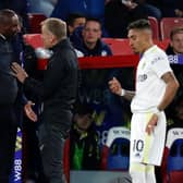 DISAGREEMENT: Crystal Palace boss Patrick Vieira, left, has words with fourth official Graham Scott after Wilfried Zaha had caught Leeds United winger Raphinha, right, with a hand to the face. Photo by IAN KINGTON/AFP via Getty Images.
