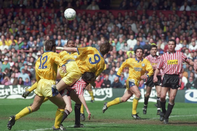 Carl Shutt and Lee Chapman challenge for the ball.