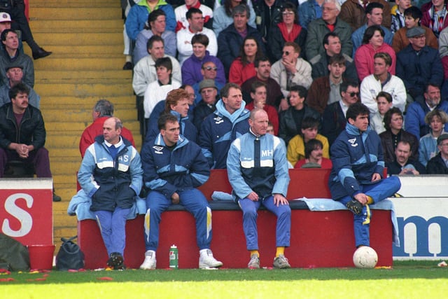 Howard Wilkinson on the bench with Eric Cantona and Gordon Strachan.