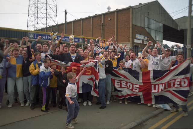 Leeds United fans celebrate outside Elland Road.