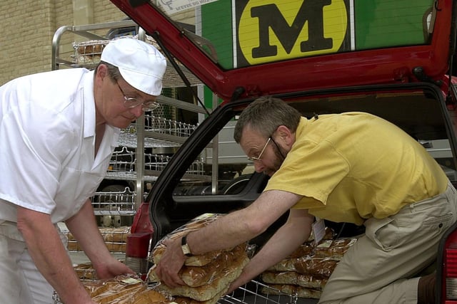 Bakers tried out the new ovens at Morrisons Kirkstall before the store officially  opened to the public. Pictured is Simon Perfitt from St Anne's Shelter loading bread into his car with the help of Morrisons baker Mike Dixon.