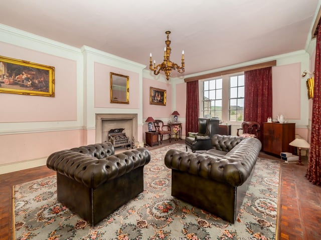 One of five reception rooms on the ground floor of the property.