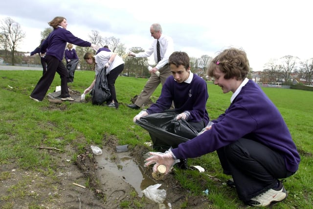 Howard Collier and Helen Smith with Year 9 pupils at Allerton Grange High clean up the school grounds as part of the Tidy Britain Groups 'Just Bin It' campaign.