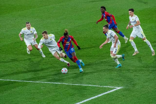 CHASE: Kalvin Phillips [far left] gives chase as Wilfried Zaha evades Leeds United pressure against Crystal Palace (Photo: Sebastian Frej/MB Media/Getty Images)