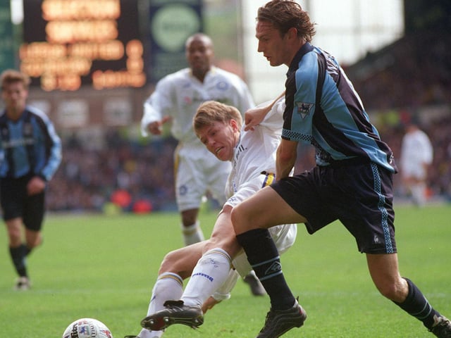 Gunnar Halle stretches to try and pinch the ball off Coventry City striker Noel Whelan.