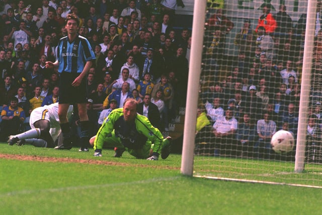 Jimmy Floyd Hasslebaink puts the ball past Coventry City goalkeeper Steve Ogrizovic to score United's first goal.